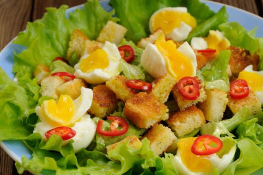 Salad Caesar with eggs, chili pepper closeup macro horizontal