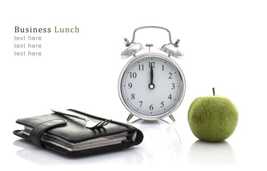 Fork on Filofax with Apple and Clock but no time for lunch, Business lunch Concept on a White Background with Copy Space