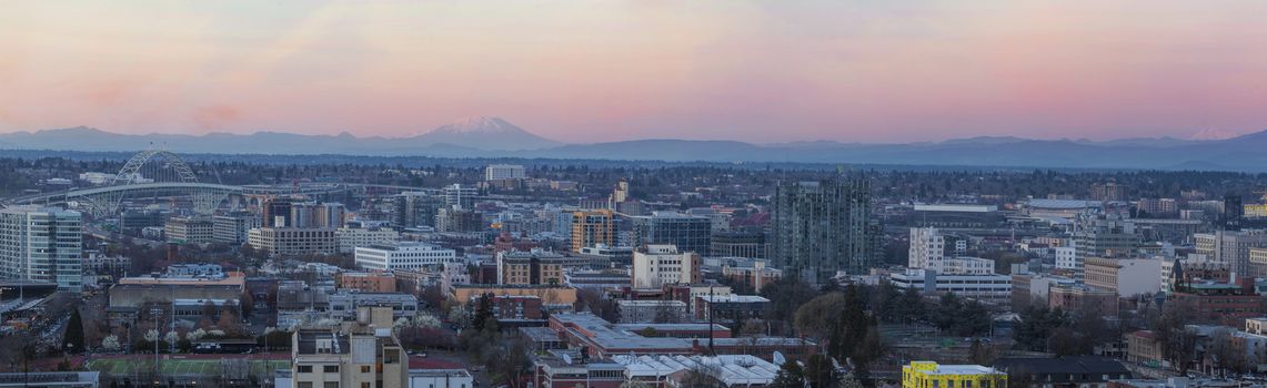 View of Portland Oregon Pearl District Cityscape with Mt St Helens and Mt Adams Fremont Bridge during Sunset Panorama