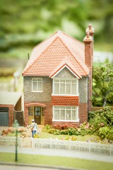 model of a generic british 1950 style suburban detached house and garden