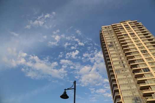 Coquitlam, BC Canada - August 24,  2014 : Brend new high rise building against blue sky in Coquitlam BC Canada.