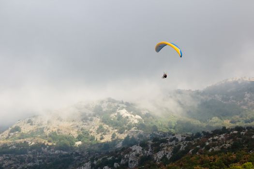 The Paraglide silhouette over mountain peaks. Montenegro