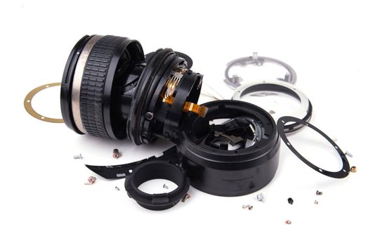 camera lens has been dropped and shattered on white background