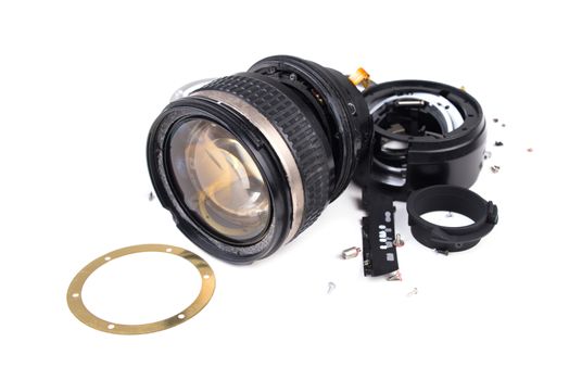camera lens has been dropped and shattered on white background