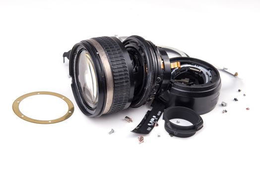 camera lens has been dropped and shattered on white background
