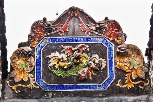 Ceramic Carp Fish Figures Statues Dragons Chen Ancestral Taoist Temple Guangzhou City Guangdong Province China.  Most famous Taoist Ancestral temple in Guangzhou City, Guangdong Province, China.  Temple built in the Qing Dynasty in 1894.  Now known as Museum of Folk Arts and Crafts.