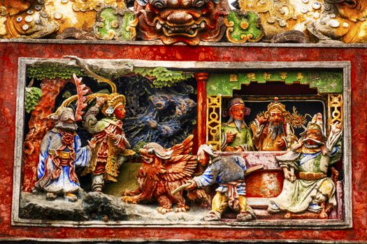 Ceramic Figures Statues Dragons Chen Ancestral Taoist Temple Guangzhou City Guangdong Province China.  Most famous Taoist Ancestral temple in Guangzhou City, Guangdong Province, China.  Temple built in the Qing Dynasty in 1894.  Now known as Museum of Folk Arts and Crafts.