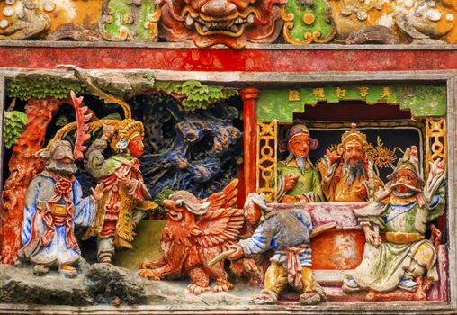 Ceramic Figures Statues Dragons Chen Ancestral Taoist Temple Guangzhou City Guangdong Province China.  Most famous Taoist Ancestral temple in Guangzhou City, Guangdong Province, China.  Temple built in the Qing Dynasty in 1894.  Now known as Museum of Folk Arts and Crafts.