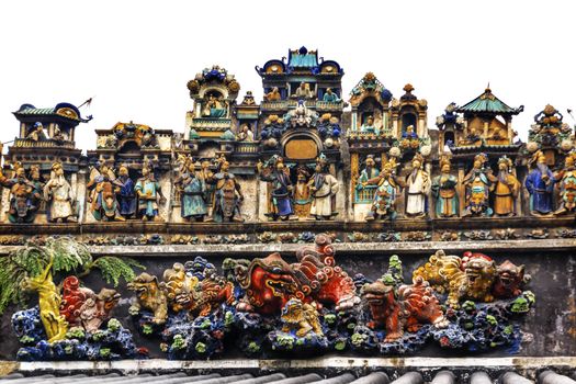 Ceramic Figures Statues Dragons Chen Ancestral Taoist Temple Guangzhou City Guangdong Province China.  Most famous Taoist Ancestral temple in Guangzhou City, Guangdong Province, China.  Temple built in the Qing Dynasty in 1894.  Now known as Museum of Folk Arts and Crafts.