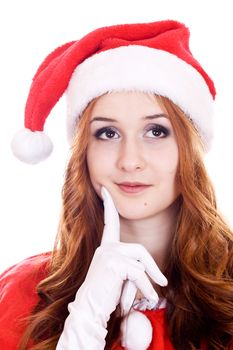 Thoughtful young woman in Christmas hat looking on copy space.