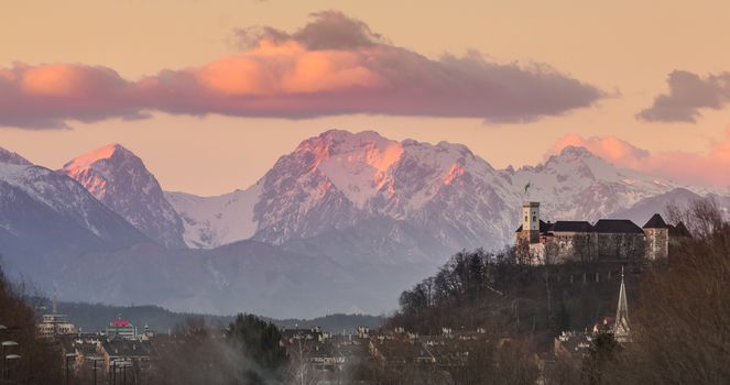 Cityscape of the Slovenian capital Ljubljana at sunset. The Karawanks mountain range in the background.