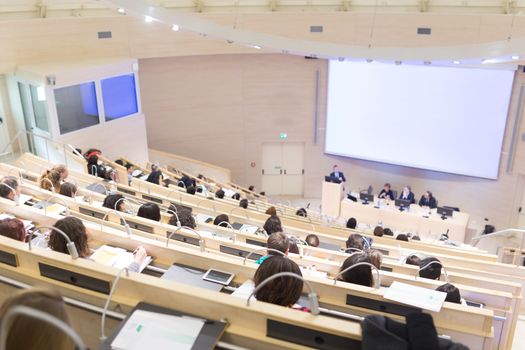 Conference and Presentation. Audience at the conference hall. Business and Entrepreneurship. Faculty lecture and workshop. Audience in the lecture hall. Academic education. Student making notes.