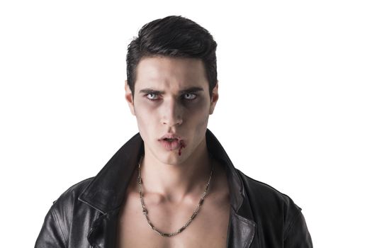 Portrait of a Young Vampire Man in an Open Black Leather Jacket, Looking at the Camera, on a White Background.