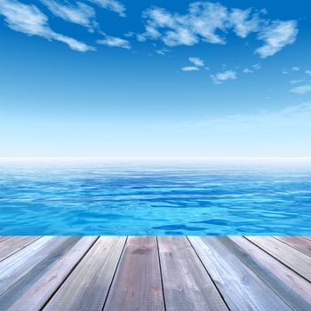 Concept or conceptual wood deck over blue sea and sky