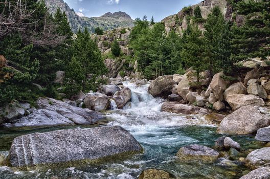 Beautiful river into the Pyrenees mountains with cristal clear water.