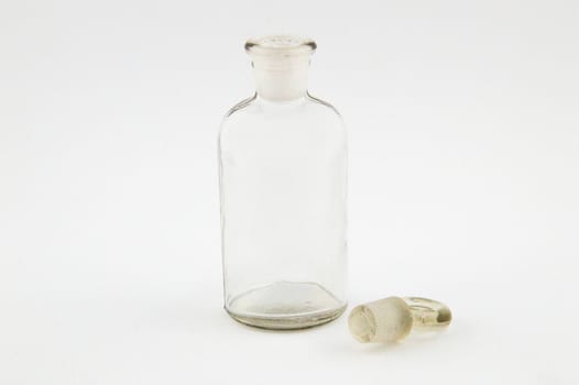 Glass bottle pharmacy in light gray background