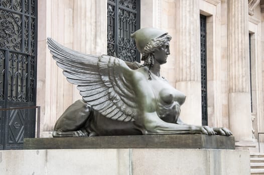 sculpture in the door of the Archaeological Museum of Madrid