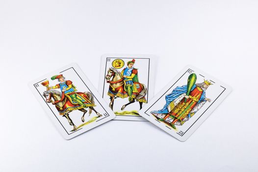 Three Spanish playing cards isolated