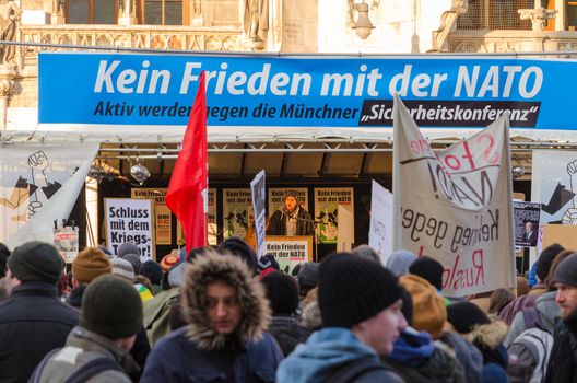 Munich, Germany - February 7, 2015: European anti-NATO protest meeting. Text on the banner reads as "No friendship with NATO".