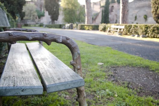 relax and enjoy the scenery from a wooden bench in Rome.