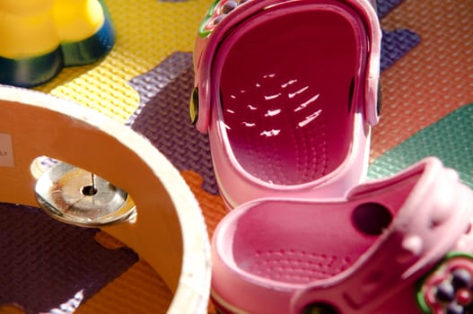 carpet of children with above small shoes and toys