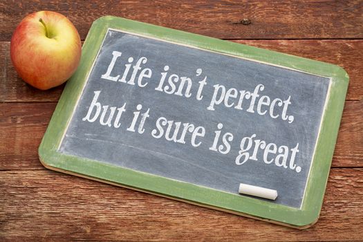 Life is not perfect, but it sure is great w - positive words on a slate blackboard against red barn wood