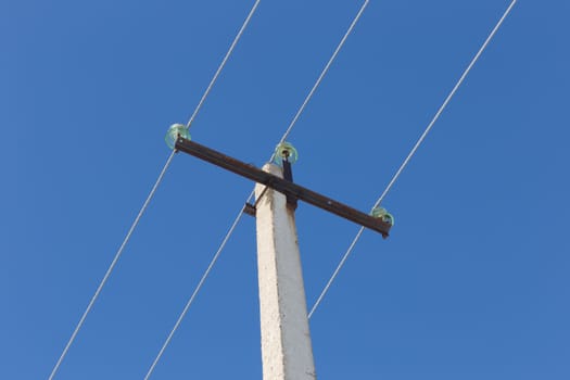 high-voltage line on the background of blue sky