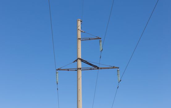 high-voltage line on the background of blue sky