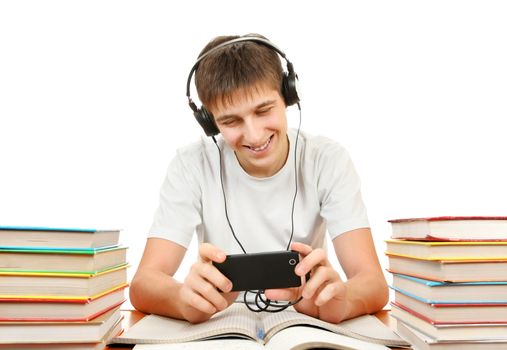 Cheerful Student listen the Music with the Books on the White Background