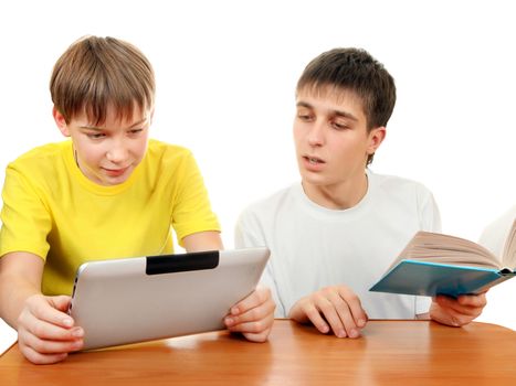 Kid with Tablet and Teenager with the Book on the White Background
