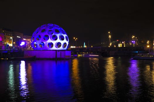 AMSTERDAM, NETHERLANDS - DEC 26 2013: Piece of light art at night during the Amsterdam Light festival in Amsterdam, the Netherlands on December 26, 2013