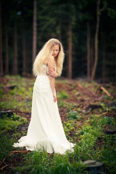 Lovely bride outdoors in a forest