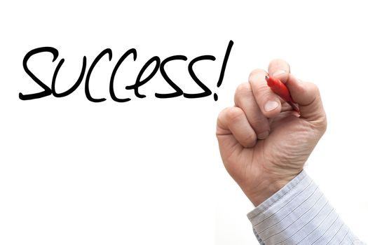 A Photo / Illustration of a Hand Writing 'Success!'