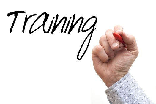 A Photo / Illustration of a Hand Writing 'Training'