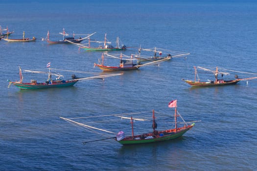 The fishing boat anchored at the beach.