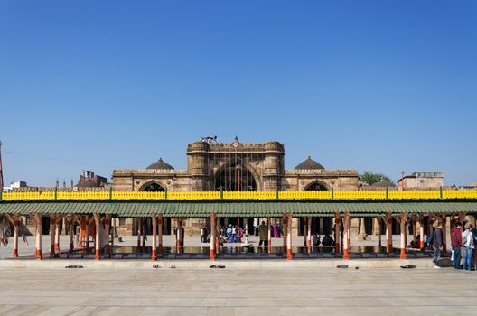 Ahmedabad, India - December 28, 2014: Muslim people at Jama Masjid also known as Jami or Jumma Mosque, is the most splendid mosque of Ahmedabad, built in 1424 during the reign of Ahmed Shah I.