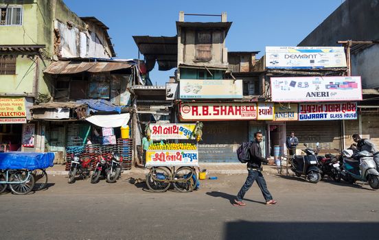 Ahmedabad, India - December 28, 2014: Indian people on Street of the Ahmedabad city on December 28, 2014. Ahmedabad is the largest city and former capital of the western Indian state of Gujarat.