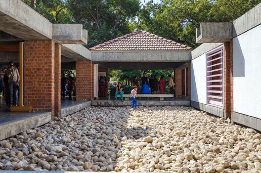 Ahmedabad, India - December 28, 2014: People visit Mahatma Gandhis museum in Sabarmati Ashram. Sabarmati Ashram is the spiritual center founded by Mahatma Gandhi in 1917, headquater of freedom fighting