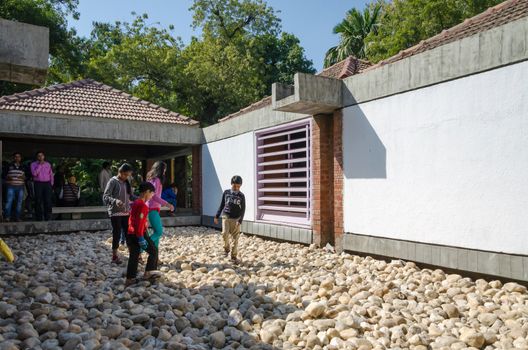 Ahmedabad, India - December 28, 2014: Indian People visit Mahatma Gandhis museum in Sabarmati Ashram. Sabarmati Ashram is the spiritual center founded by Mahatma Gandhi in 1917, headquater of freedom fighting