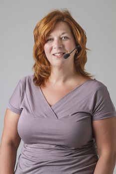 red hair female phone agent with headset