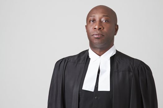 Bald black man wearing a judicial toga