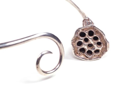 Close up of silver necklace isolated on white background, manufactured by Ornella Salamone