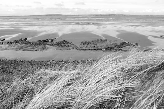 view of unusual looking mud banks in county Kerry Ireland from the sand dunes