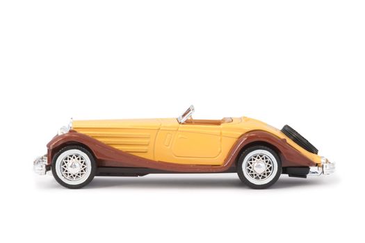 old miniature model sports car on white