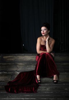 Lady in red sitting on stairs