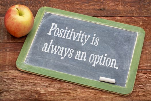 Positivity is always an option - text \ on a slate blackboard against red barn wood