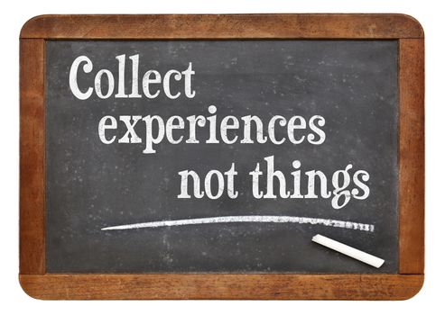 Collect experiences not things - words of inspiration on a vintage slate blackboard