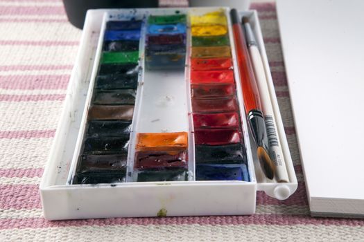 Beautiful illustration of a professional artist paints and brushes.