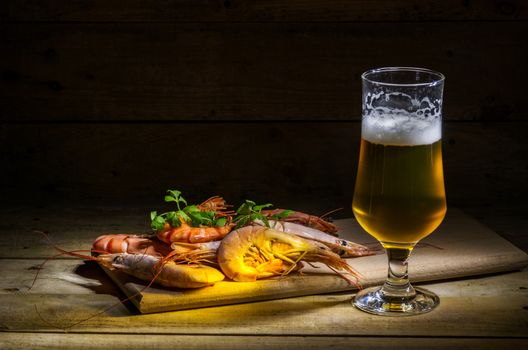 still life with beer, shrimp and herbs