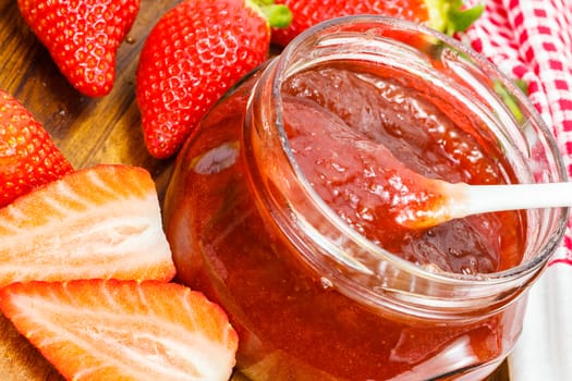 Strawberry jam with fresh strawberries